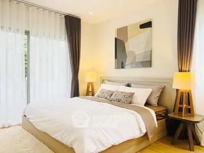 Elegant bedroom with modern decor, large windows, and stylish lighting, perfect for relaxation and comfort.