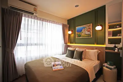Cozy bedroom with elegant decor and natural light, featuring a comfortable bed and stylish wall art.
