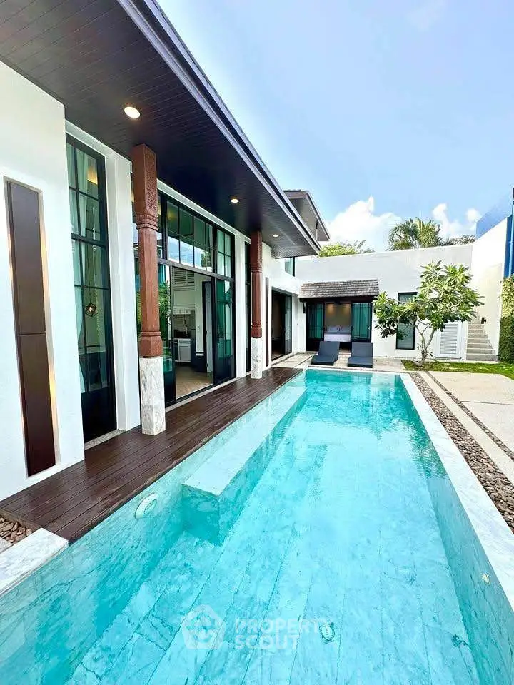 Luxurious modern villa with private pool and elegant exterior design.