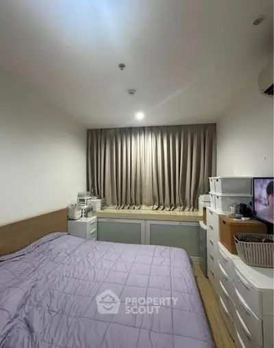 Cozy bedroom with modern furnishings and soft lighting