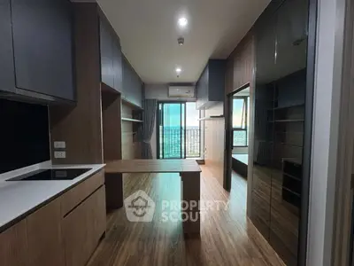 Modern apartment interior with wooden flooring and open balcony view