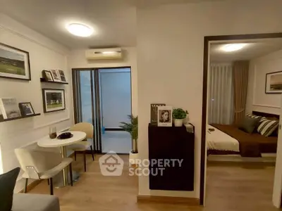 Modern apartment interior with cozy living area and stylish bedroom, perfect for urban living.
