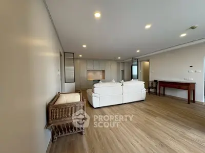 Spacious modern living room with elegant furniture and open layout, perfect for relaxation and entertainment.