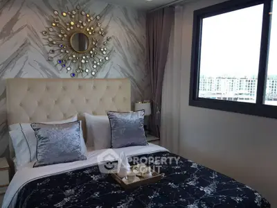 Luxurious bedroom with elegant decor and city view, featuring a stylish bed and decorative wall mirror.