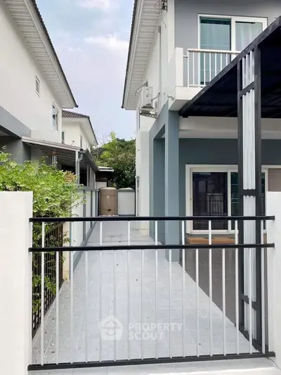 Modern house exterior with sleek design and spacious driveway