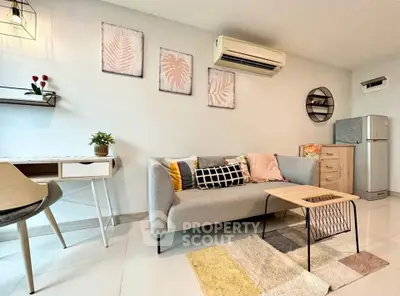 Modern living room with stylish decor, cozy sofa, and air conditioning unit.