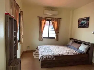 Cozy bedroom with wooden furniture and air conditioning