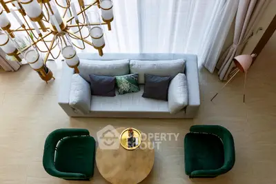 Luxurious living room with elegant chandelier and stylish furniture