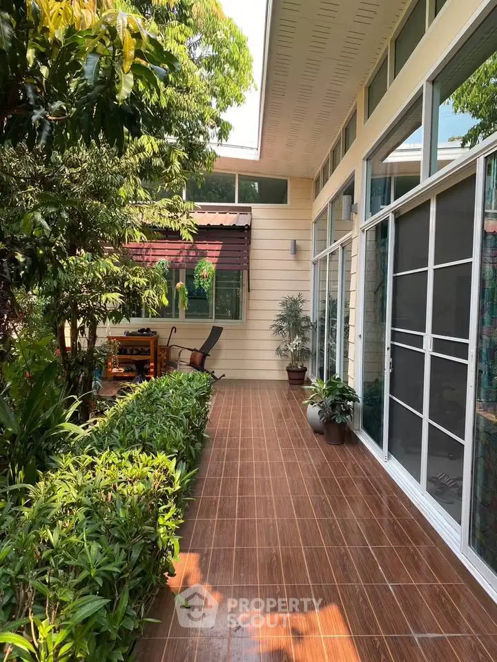 Charming garden view with modern patio and lush greenery