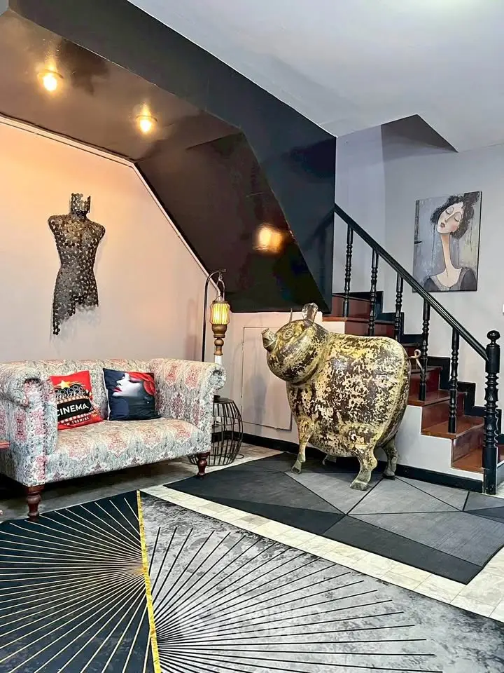 Stylish living room with unique decor and modern staircase