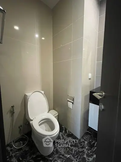 Modern bathroom with sleek design and elegant tile flooring