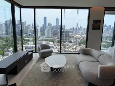 Luxurious living room with panoramic city skyline view and modern furniture.