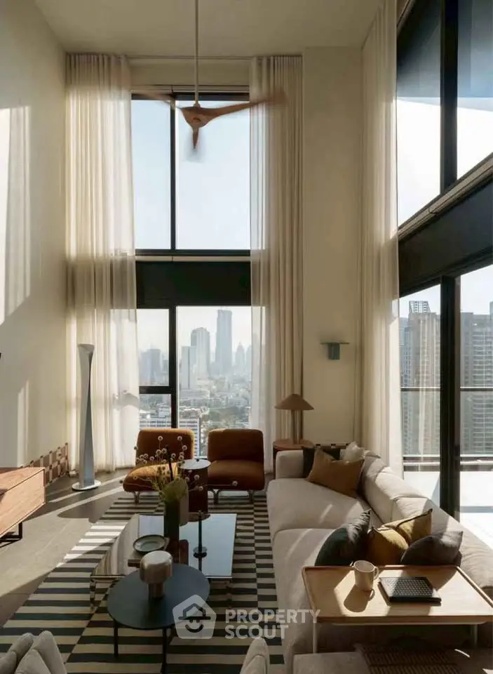 Luxurious high-ceiling living room with stunning city view and modern decor