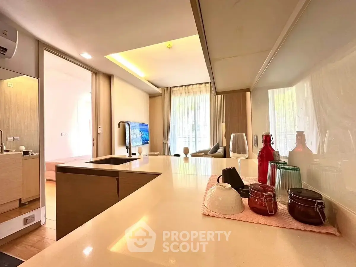 Modern open-layout kitchen with stylish living room view and elegant decor