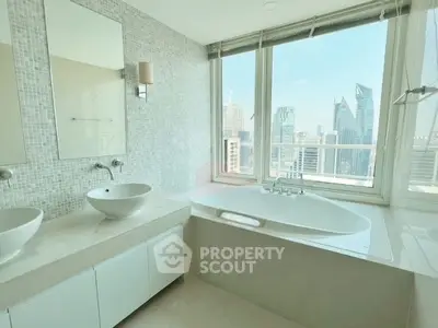 Luxurious bathroom with city skyline view and modern fixtures