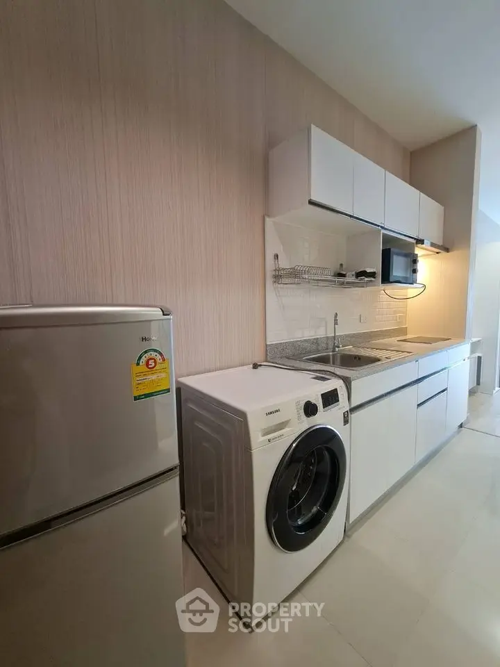 Modern kitchen with sleek appliances and minimalist design