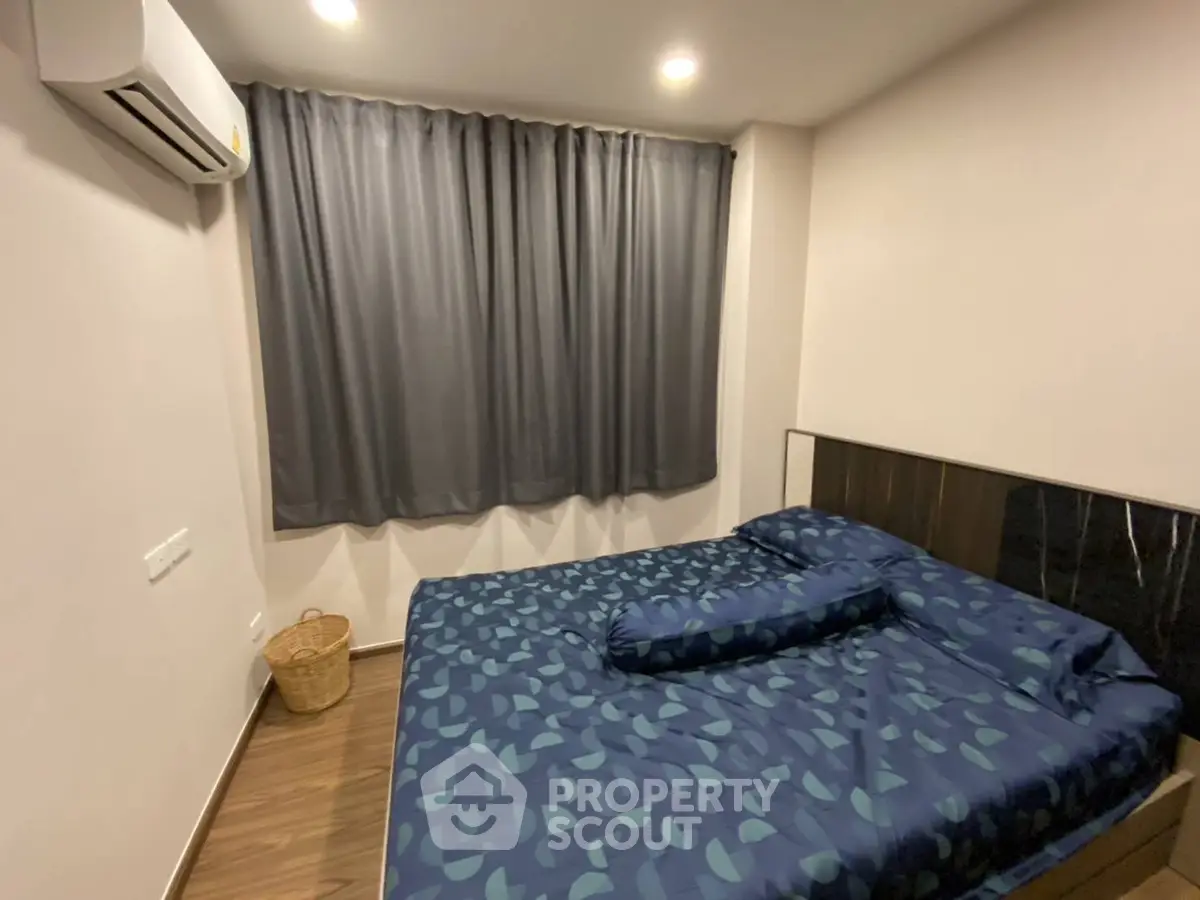 Cozy bedroom with modern decor and air conditioning