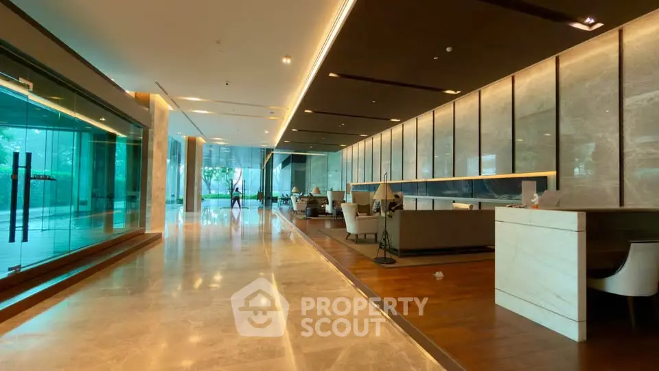 Luxurious modern lobby with elegant marble flooring and stylish seating area.