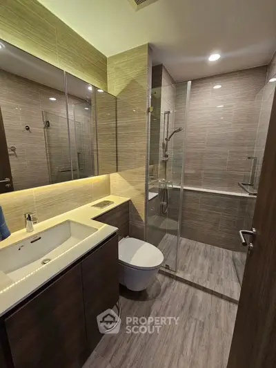 Modern bathroom with sleek design and glass shower enclosure