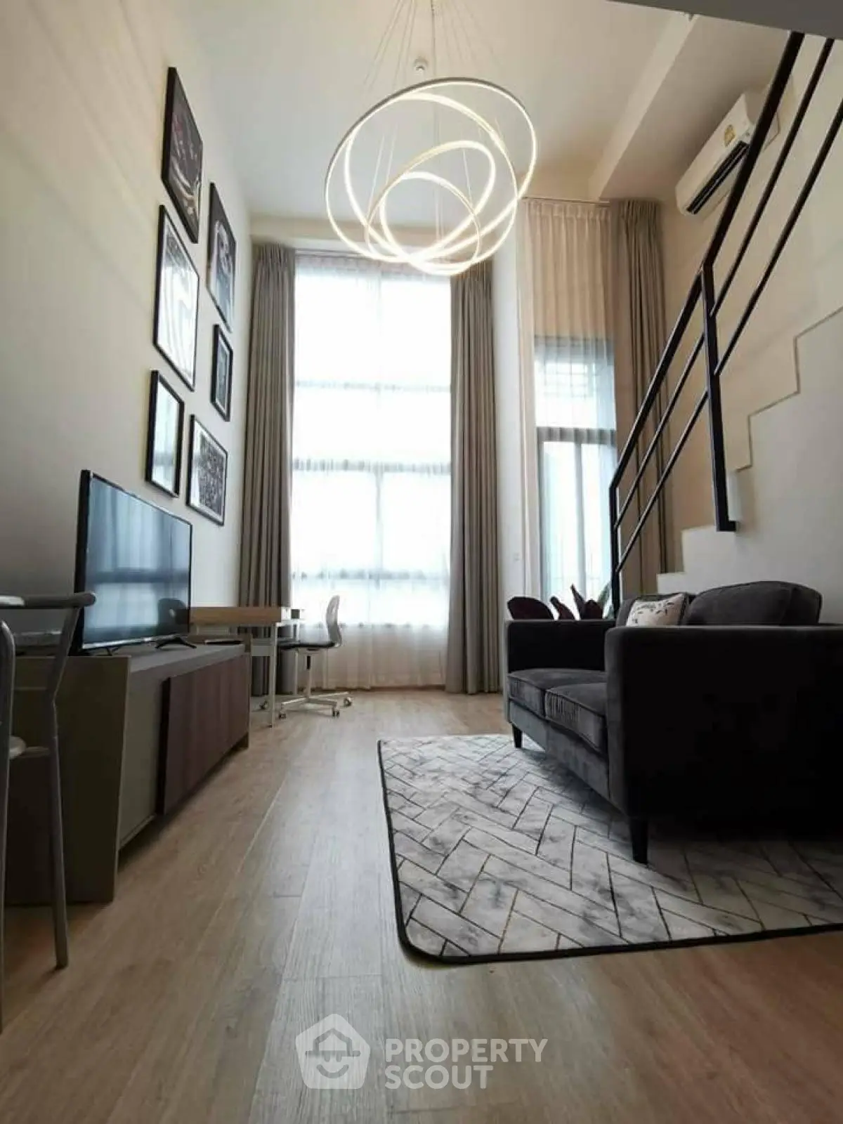 Modern loft living room with high ceiling and stylish decor