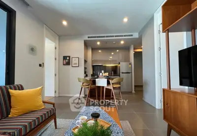 Modern living room with stylish furniture and open kitchen layout