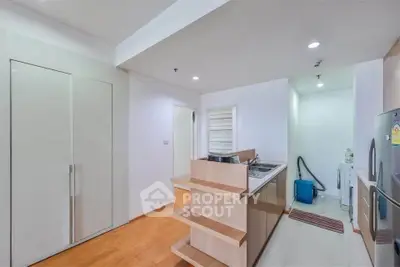 Modern kitchen with sleek cabinetry and open layout in a contemporary apartment.