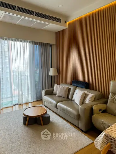 Modern living room with stylish wood paneling and cozy seating area