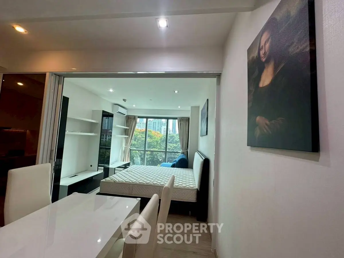 Modern studio apartment with stylish decor and city view