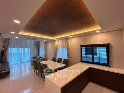 Luxurious modern living room with elegant dining area and stylish ceiling design