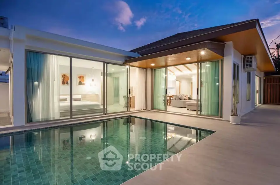 Luxurious modern villa with private pool and elegant interior design at sunset.