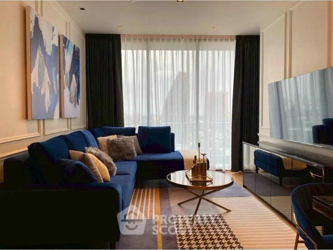 Luxurious living room with modern decor, large windows, and stylish furniture in a high-rise apartment.