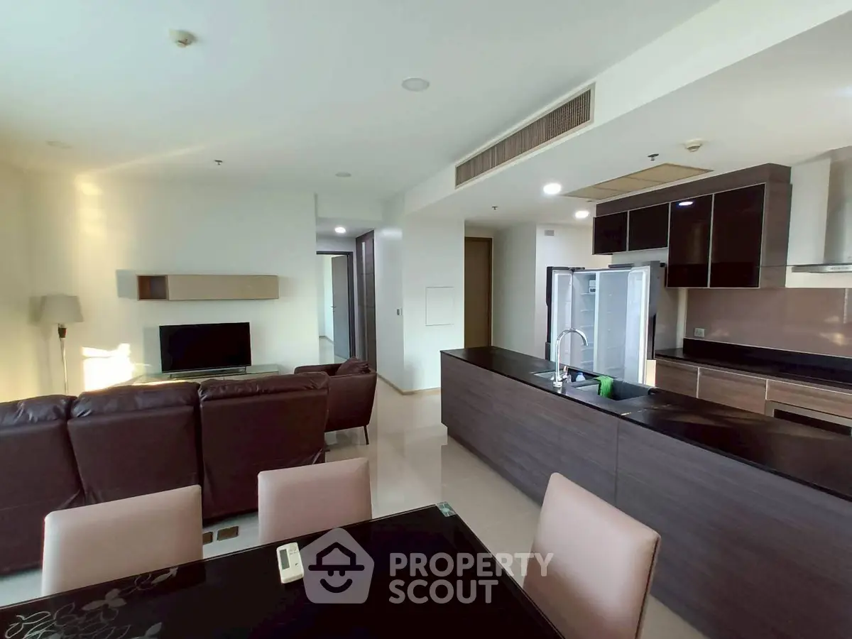 Spacious modern living room with open kitchen and stylish furniture