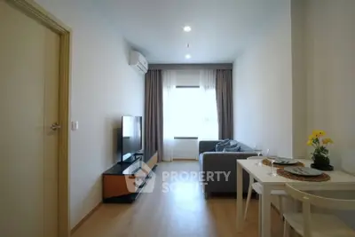 Modern living room with sleek furniture and natural light, perfect for urban living.