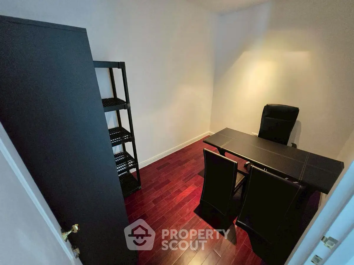 Cozy study room with elegant desk and chairs, perfect for productivity.