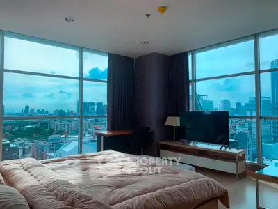 Luxurious bedroom with panoramic city view and modern furnishings