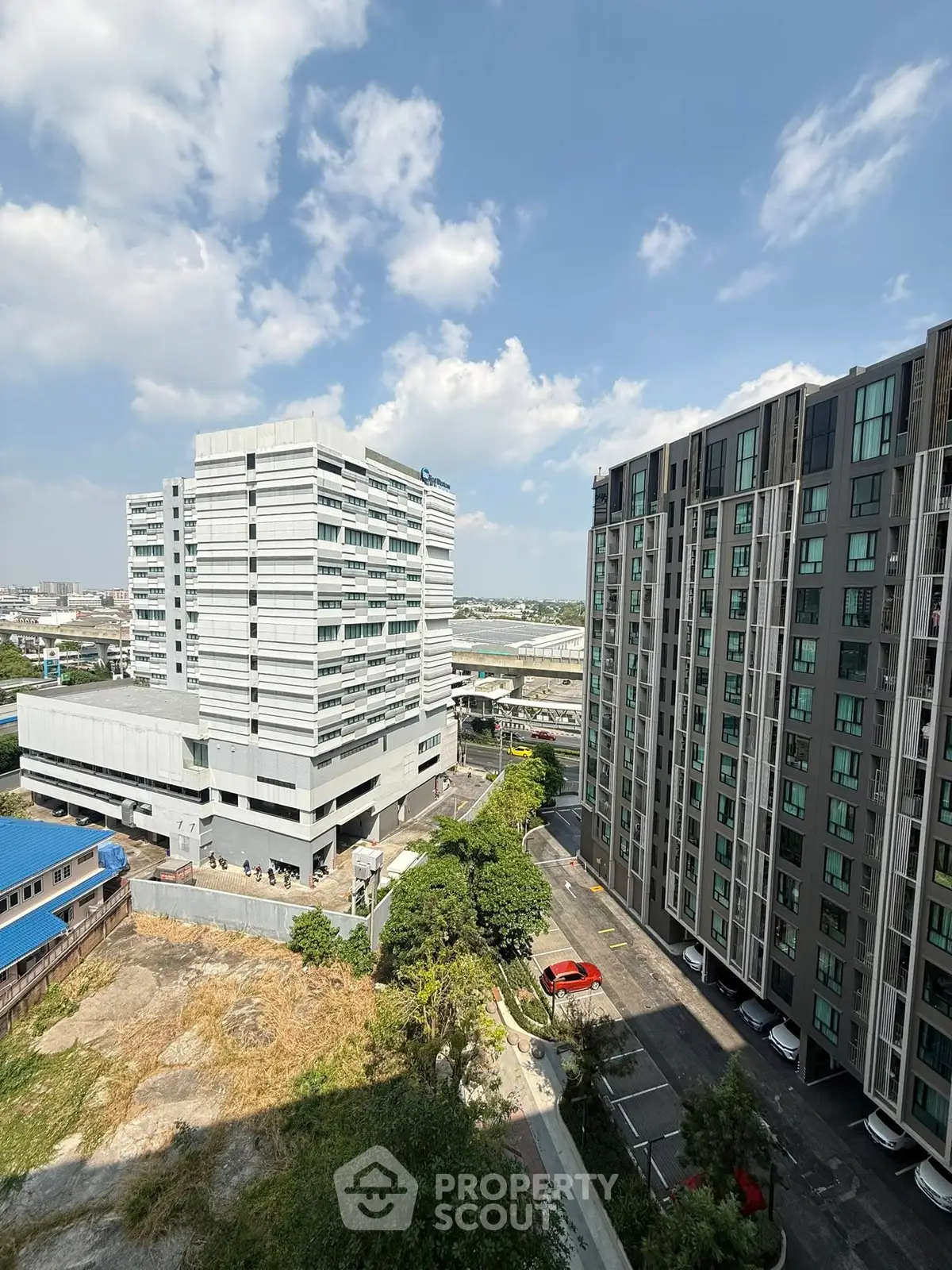 Stunning cityscape view from a high-rise building showcasing modern architecture and urban living.