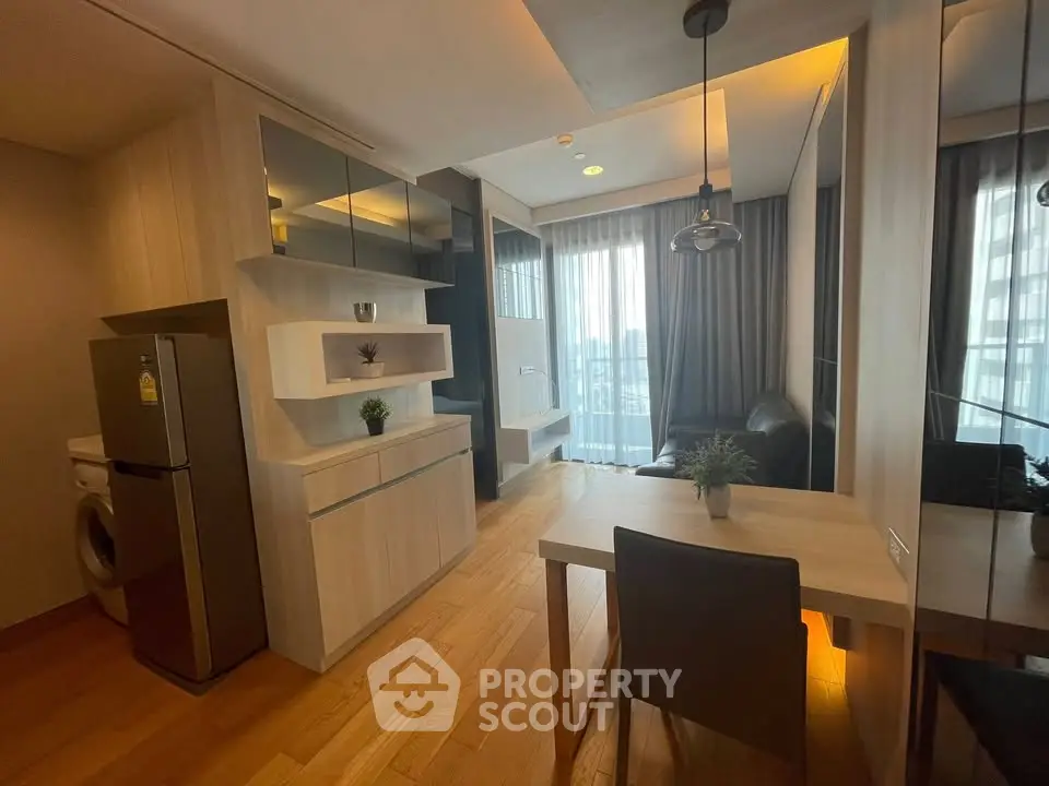Modern living room with stylish decor and natural light in a contemporary apartment.