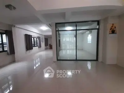 Spacious modern interior with glass partition and large windows