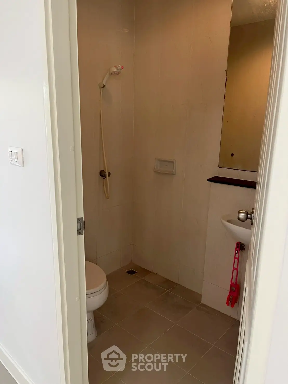 Compact bathroom with shower and toilet in modern apartment