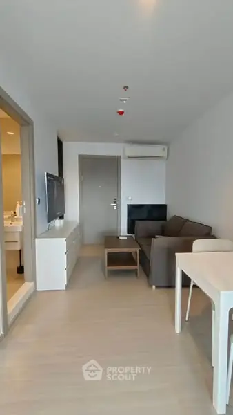 Modern living room with sleek furniture and neutral tones, perfect for urban living.