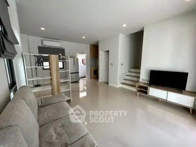 Spacious modern living room with sleek design and natural light