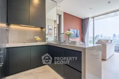 Modern kitchen with sleek design and stunning city view in luxury apartment.