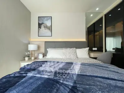 Modern bedroom with stylish decor and ample natural light