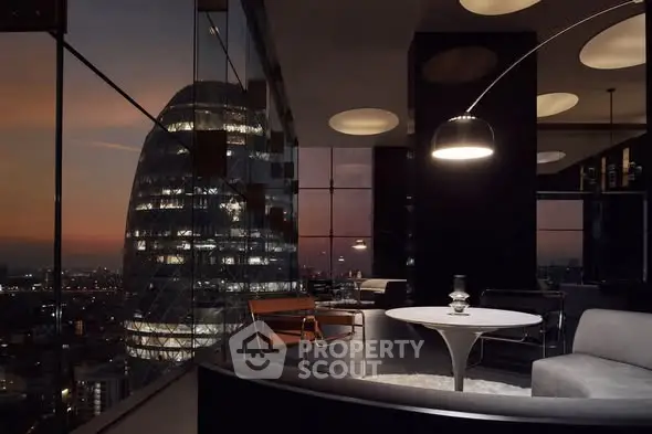 Luxurious modern living room with stunning cityscape view at sunset.