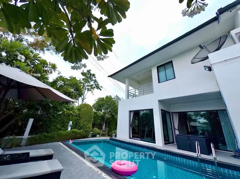 Luxurious modern house with private pool and lush garden, perfect for serene living.