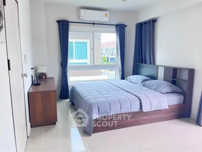 Spacious bedroom with modern design and natural light