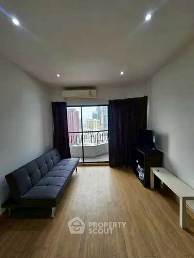 Modern living room with city view and sleek furniture