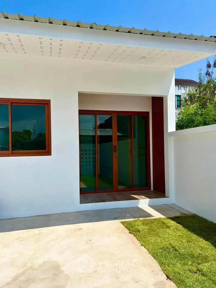 Modern single-story home with sleek design and spacious outdoor area, perfect for family living.