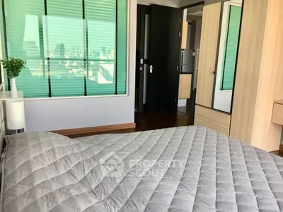 Modern bedroom with city view and stylish decor