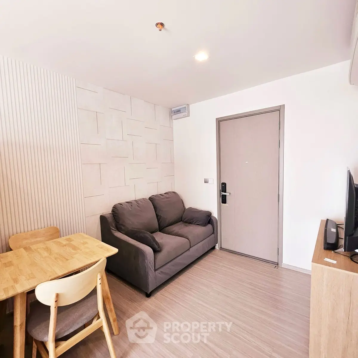 Modern living room with cozy sofa and dining area in stylish apartment